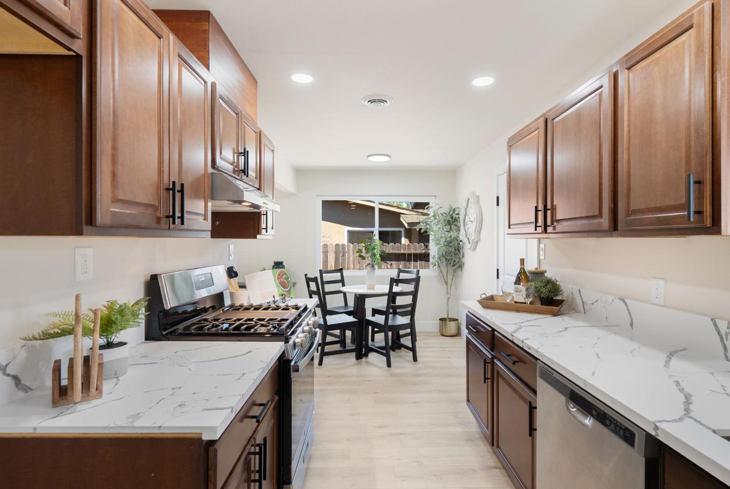 1902 Wildwood Way Roseville, CA 95661 - Photo 11 of 22 a kitchen with granite countertop a sink a stove and cabinets