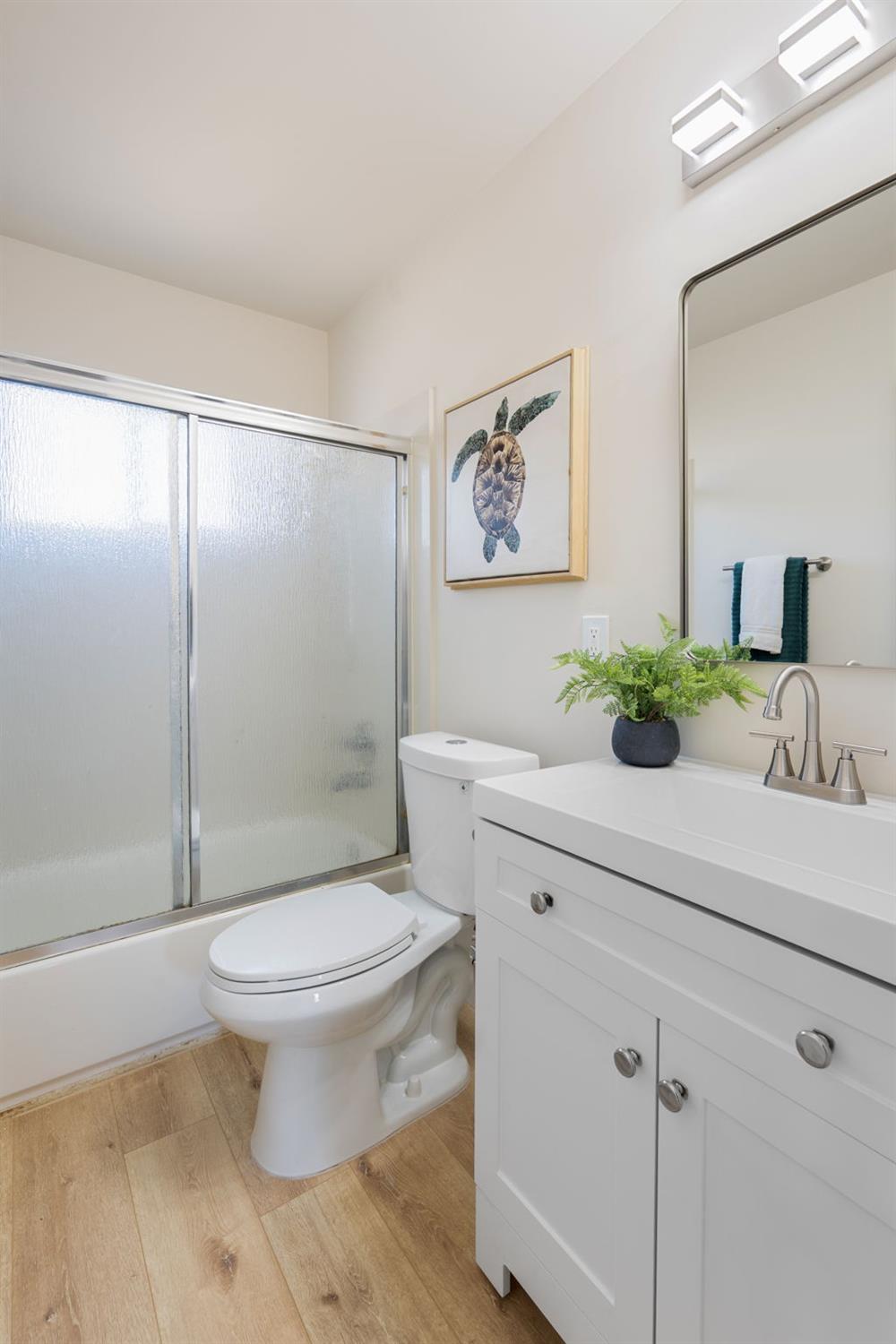 1902 Wildwood Way Roseville, CA 95661 - Photo 18 of 22 a bathroom with a sink toilet and shower