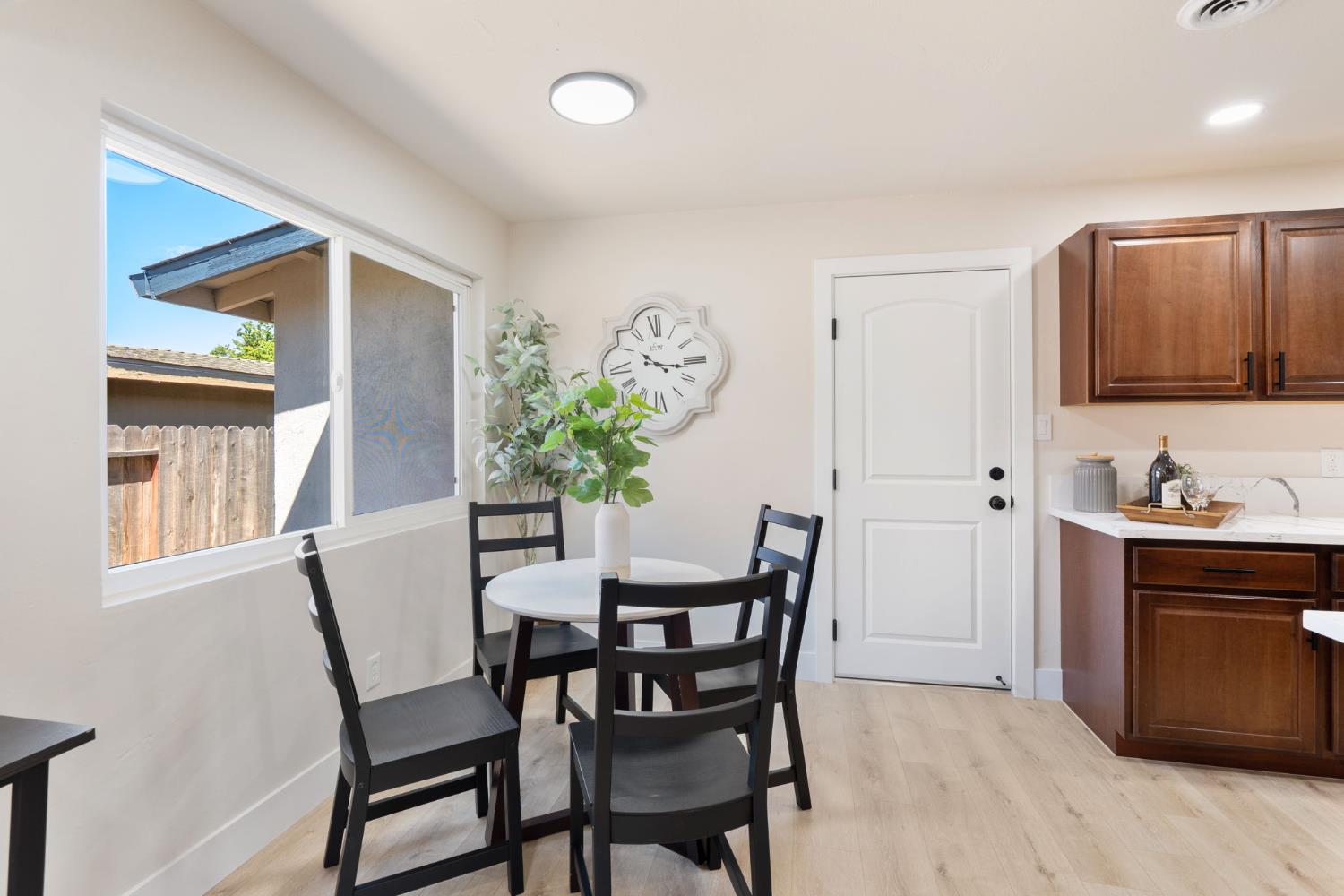 1902 Wildwood Way Roseville, CA 95661 - Photo 7 of 22 a view of a dining room with furniture and window
