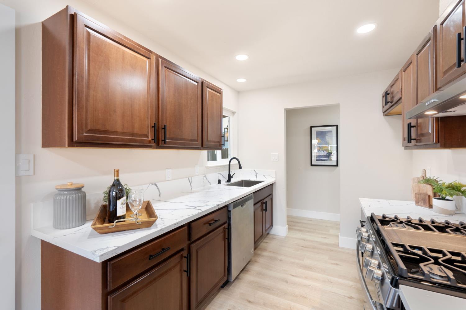 1902 Wildwood Way Roseville, CA 95661 - Photo 9 of 22 a kitchen with a sink cabinets and stove top oven