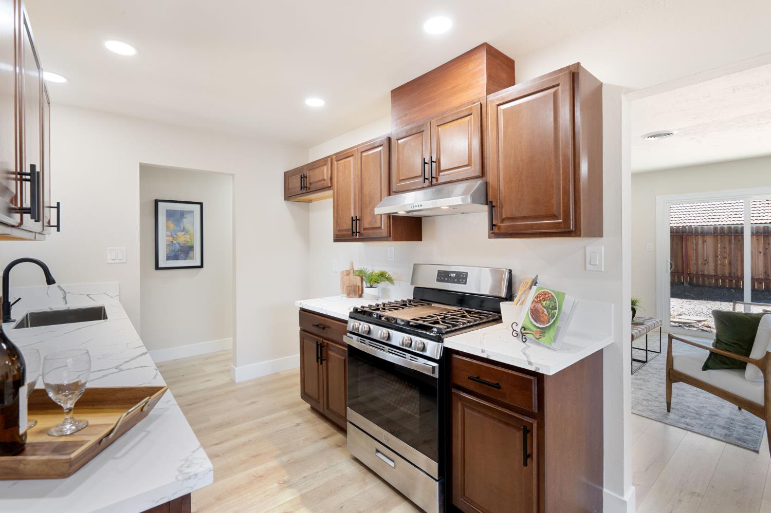1902 Wildwood Way Roseville, CA 95661 - Photo 10 of 22 a kitchen with stainless steel appliances granite countertop a stove and a sink