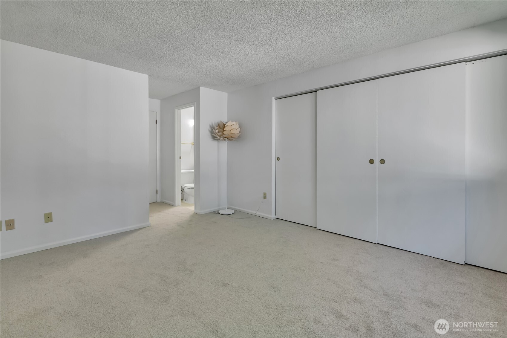 17527 149th Avenue Southeast, Unit B12 Renton, WA 98058 - Photo 17 of 27 a view of an empty room with closet area