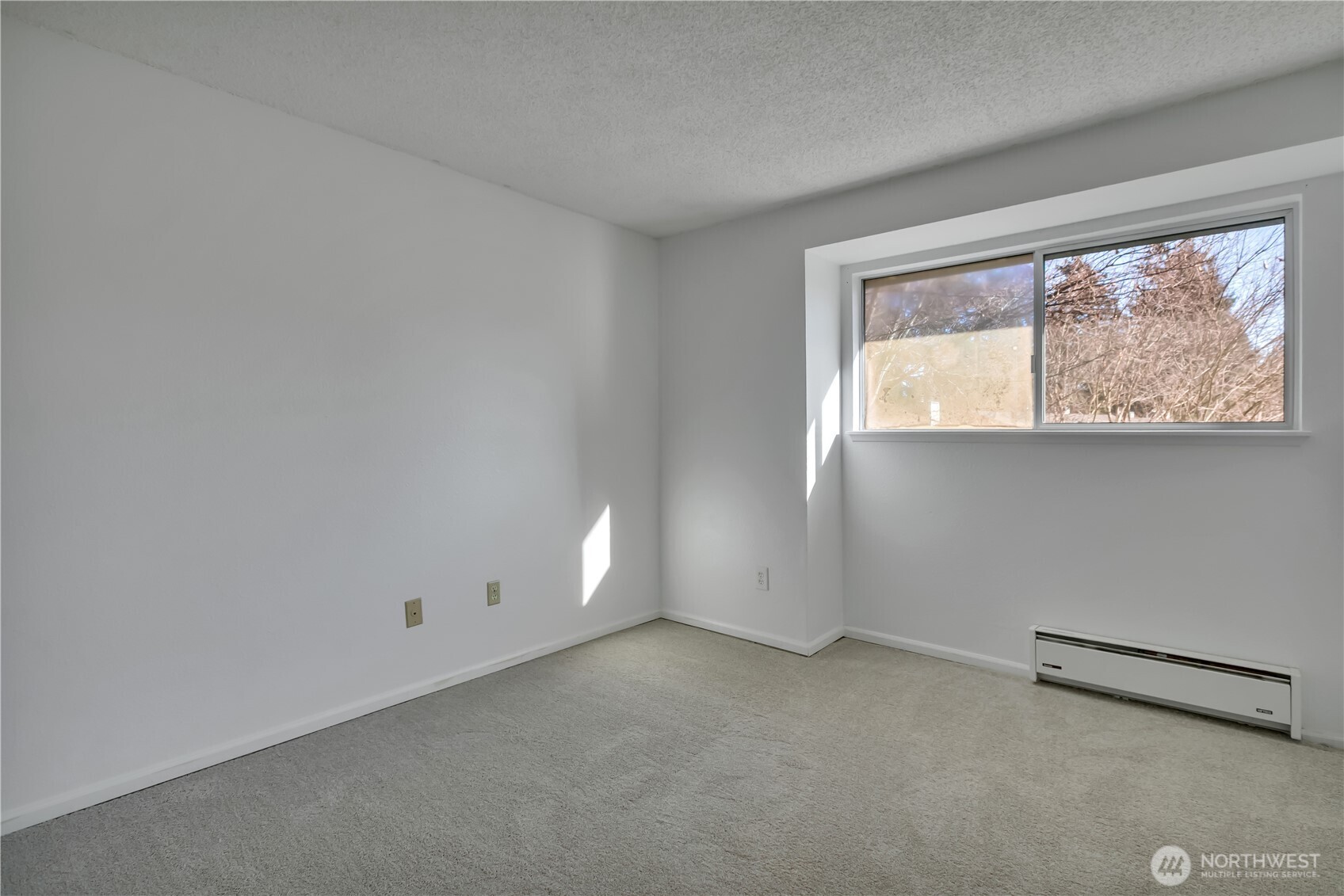 17527 149th Avenue Southeast, Unit B12 Renton, WA 98058 - Photo 20 of 27 an empty room with a window