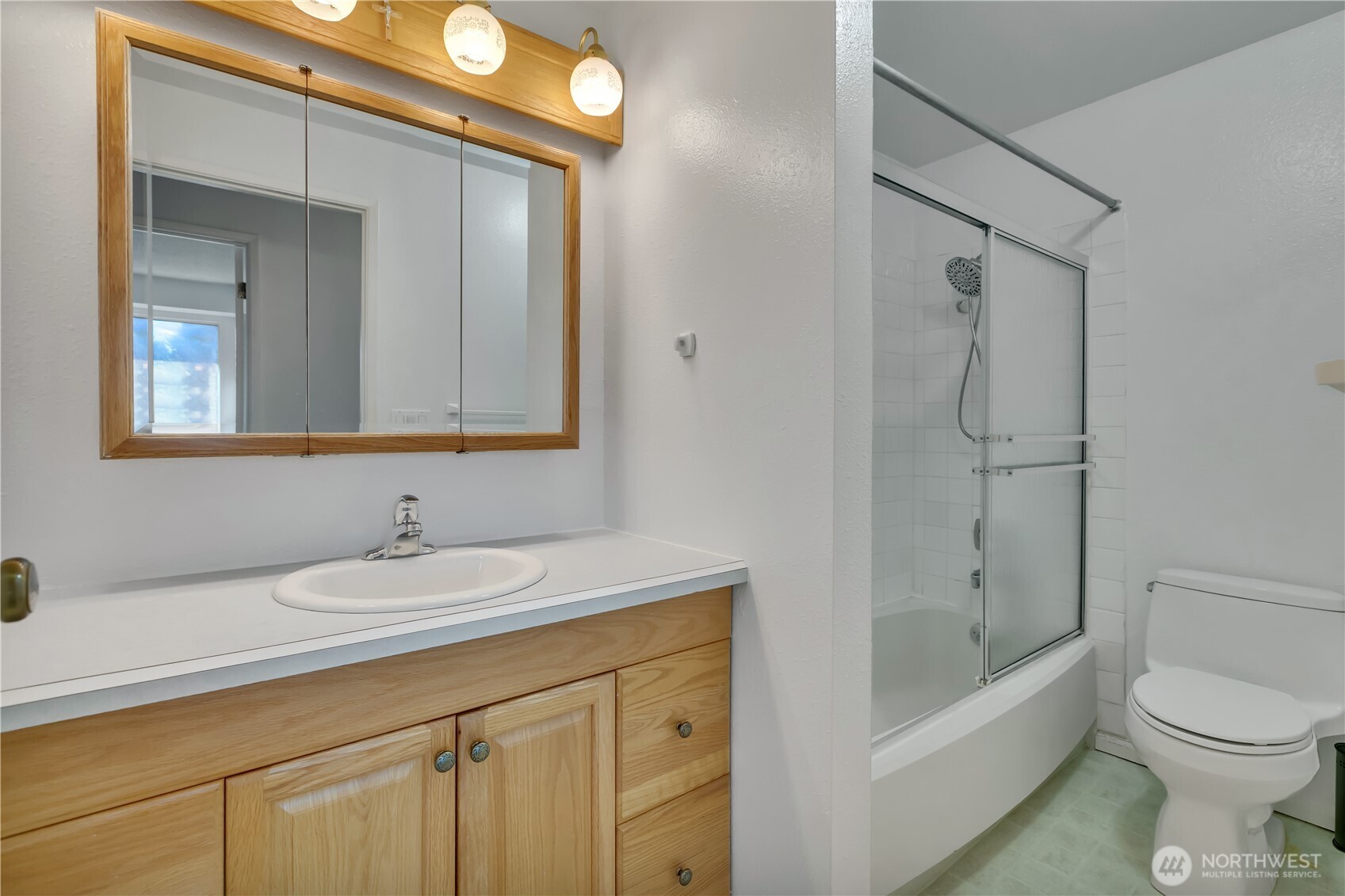 17527 149th Avenue Southeast, Unit B12 Renton, WA 98058 - Photo 21 of 27 a bathroom with a sink a toilet and shower