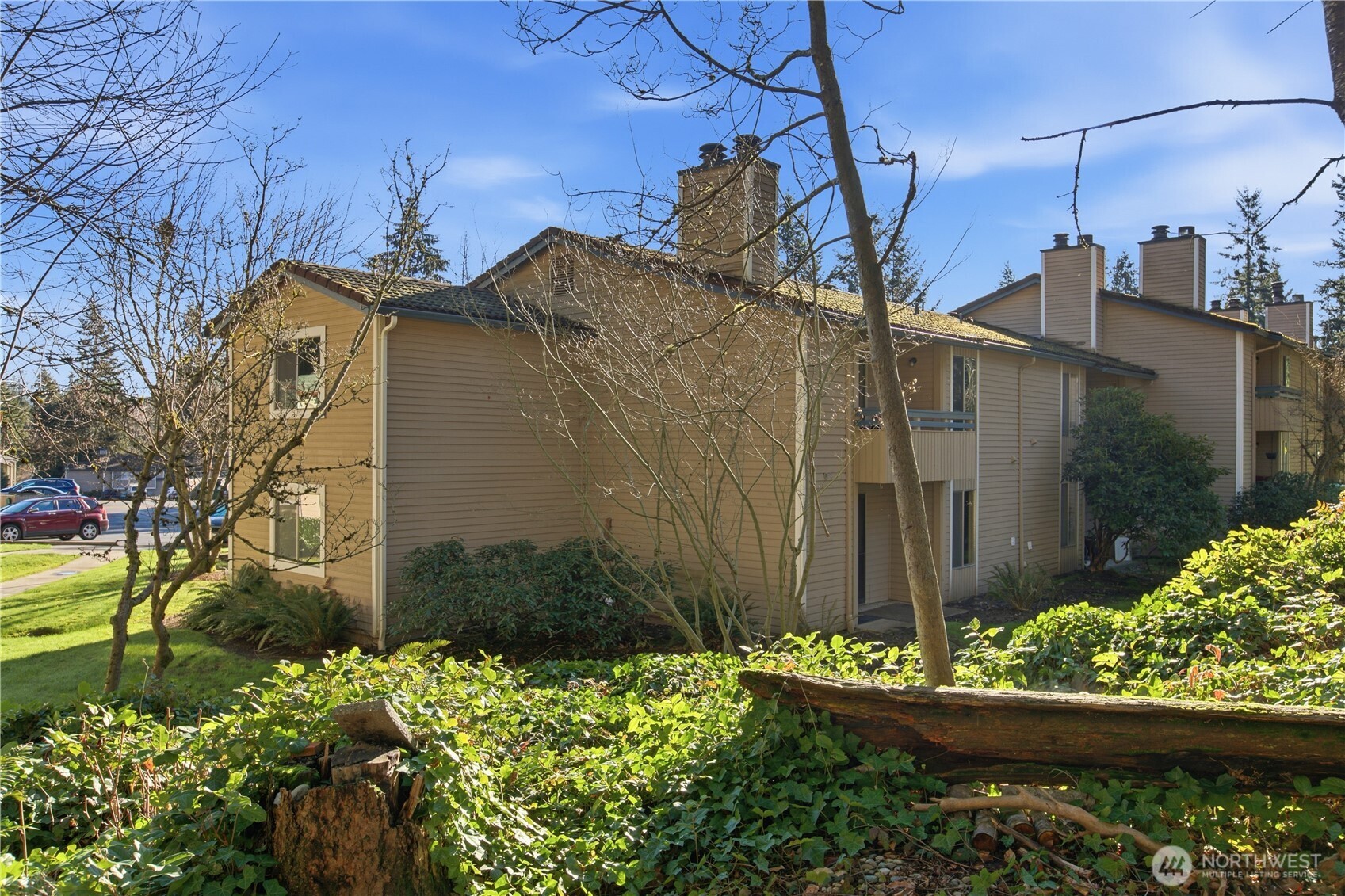 17527 149th Avenue Southeast, Unit B12 Renton, WA 98058 - Photo 25 of 27 a backyard of a house with lots of green space