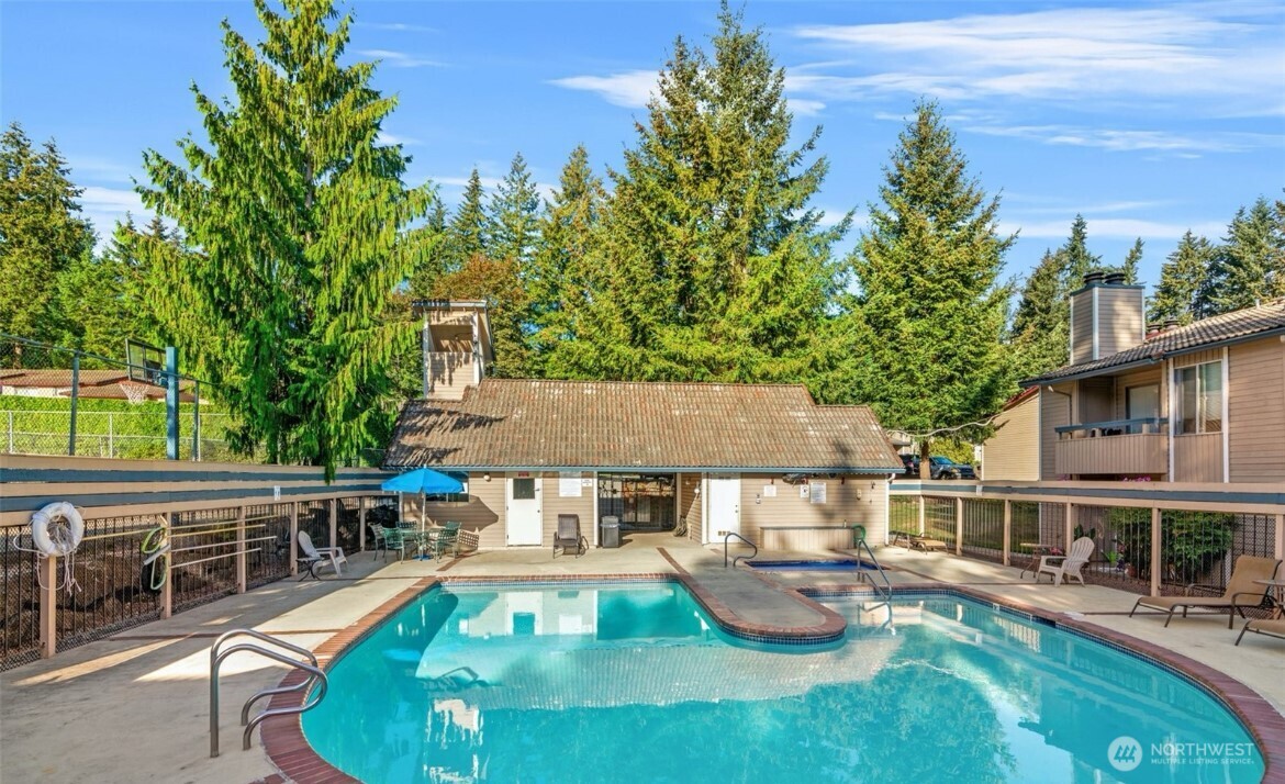 17527 149th Avenue Southeast, Unit B12 Renton, WA 98058 - Photo 26 of 27 an outdoor view of house with swimming pool and furniture