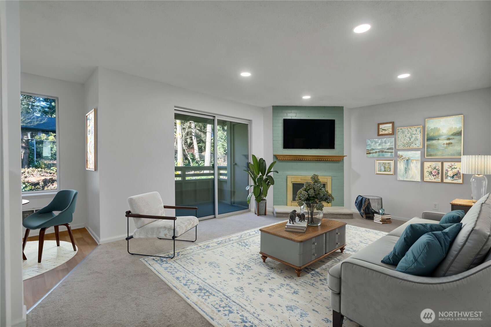 17527 149th Avenue Southeast, Unit B12 Renton, WA 98058 - Photo 5 of 27 a living room with fireplace furniture and a flat screen tv