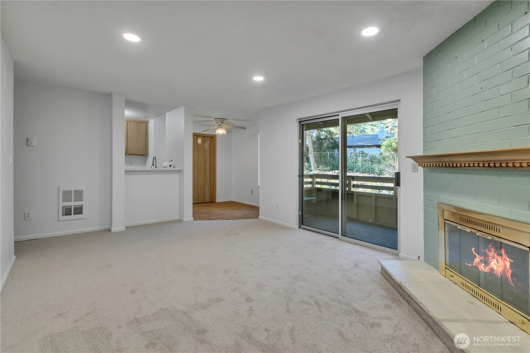 17527 149th Avenue Southeast, Unit B12 Renton, WA 98058 - Photo 7 of 27 an empty room with furniture and a fireplace