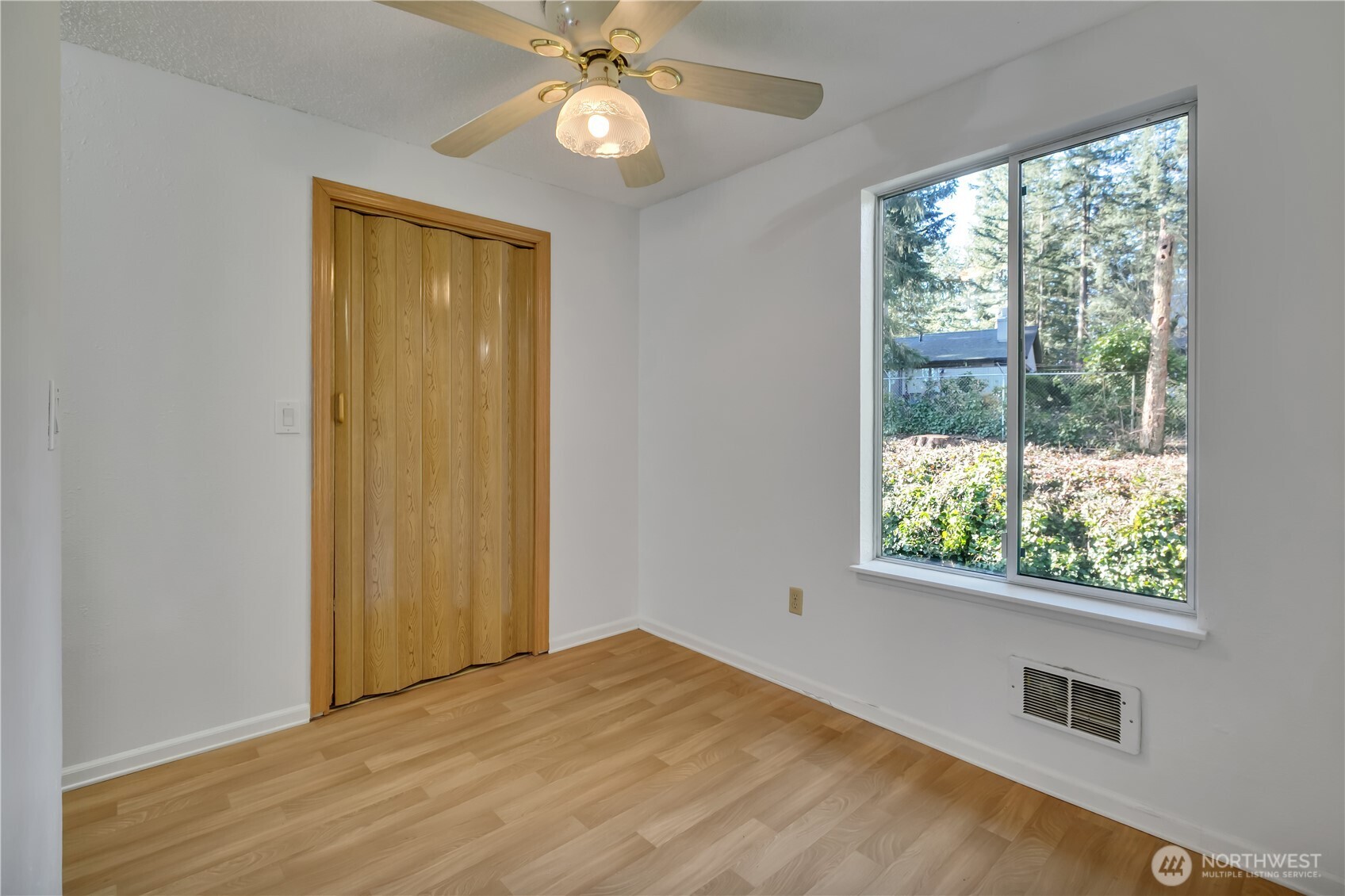 17527 149th Avenue Southeast, Unit B12 Renton, WA 98058 - Photo 9 of 27 a view of an empty room with a window