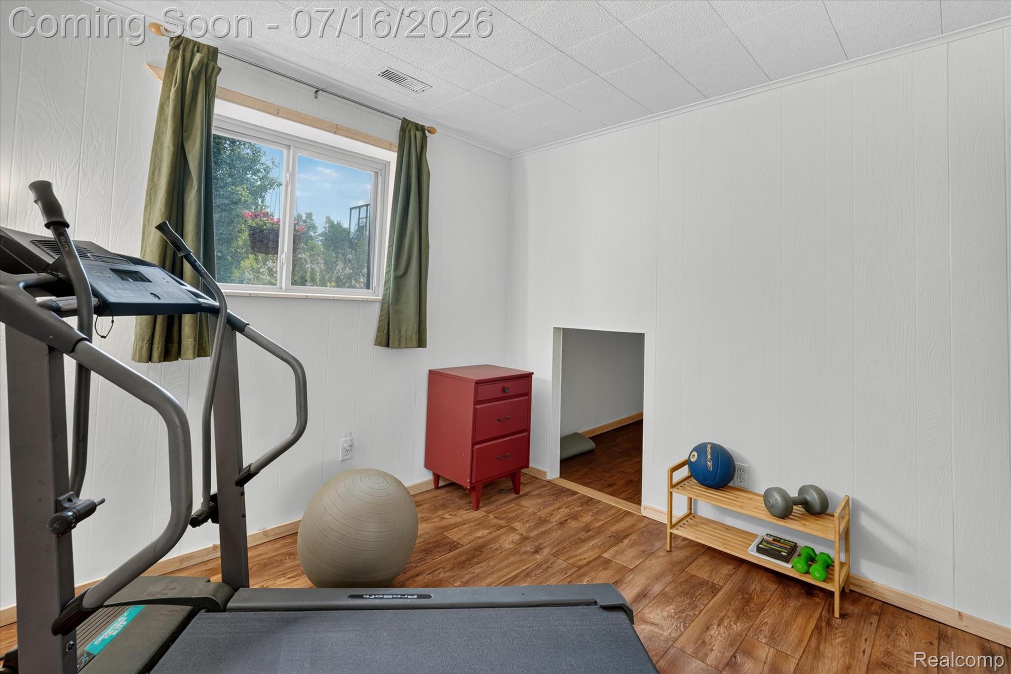 11210 Linden Road Linden, MI 48451 - Photo 25 of 61 Versatile room featuring wood-finish flooring, white paneled walls, and a recessed ceiling