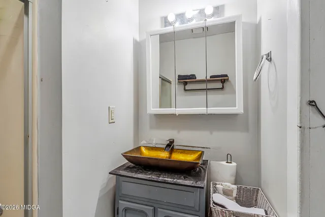 a bathroom with a shower and a toilet