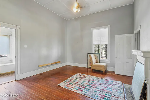 a living room with furniture and a rug