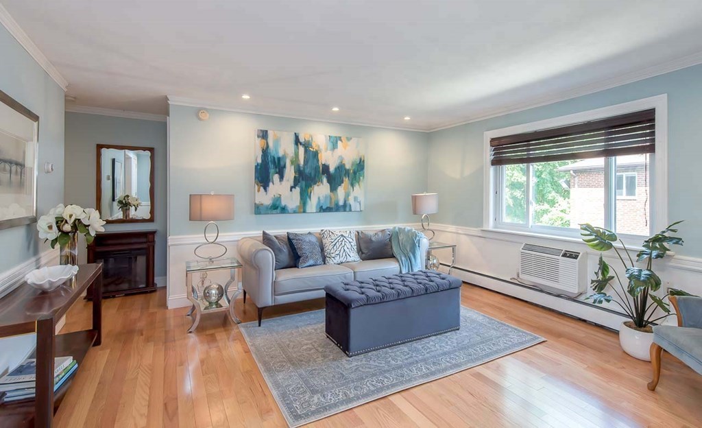 62 Bryon Road, Unit 6 Boston, MA 02467 - Photo 1 of 23 a living room with furniture and a large window