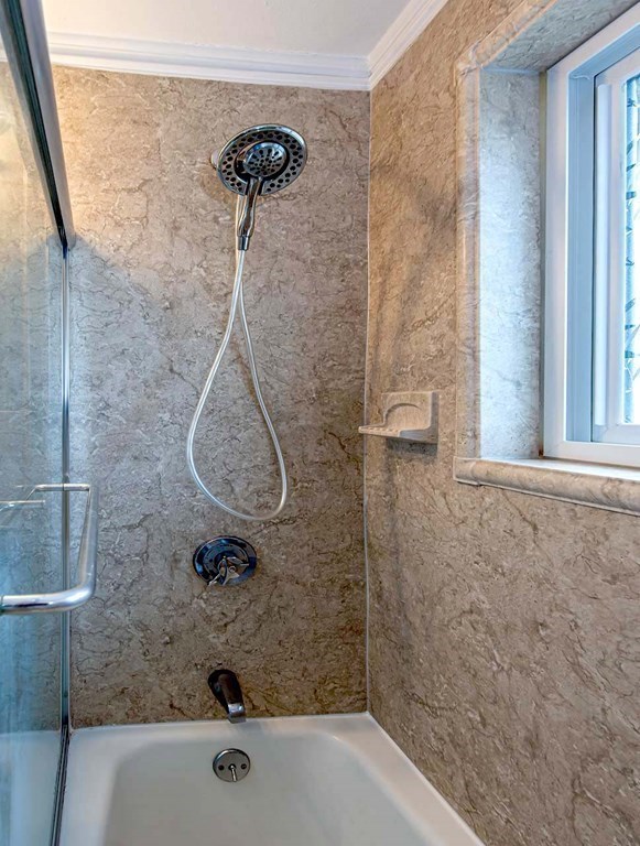 62 Bryon Road, Unit 6 Boston, MA 02467 - Photo 15 of 23 a bathroom with a bath tub and a shower