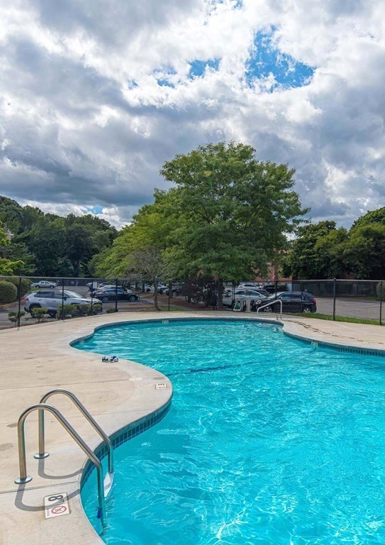 62 Bryon Road, Unit 6 Boston, MA 02467 - Photo 20 of 23 a view of a swimming pool with a yard