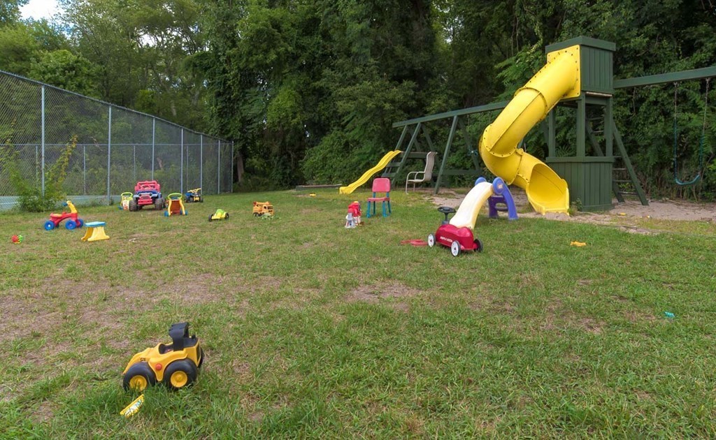 62 Bryon Road, Unit 6 Boston, MA 02467 - Photo 22 of 23 a view of a park with swings and slides