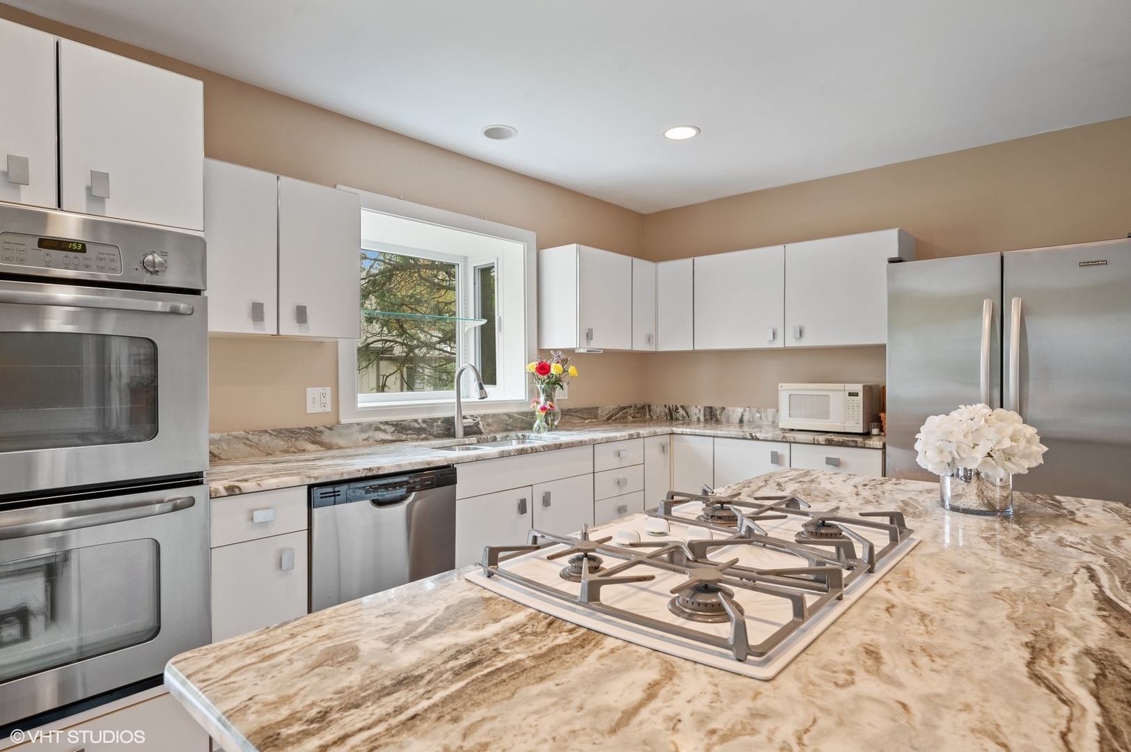 63 Overlook Drive Golf, IL 60029 - Photo 12 of 32 a kitchen with granite countertop a sink stove and cabinets