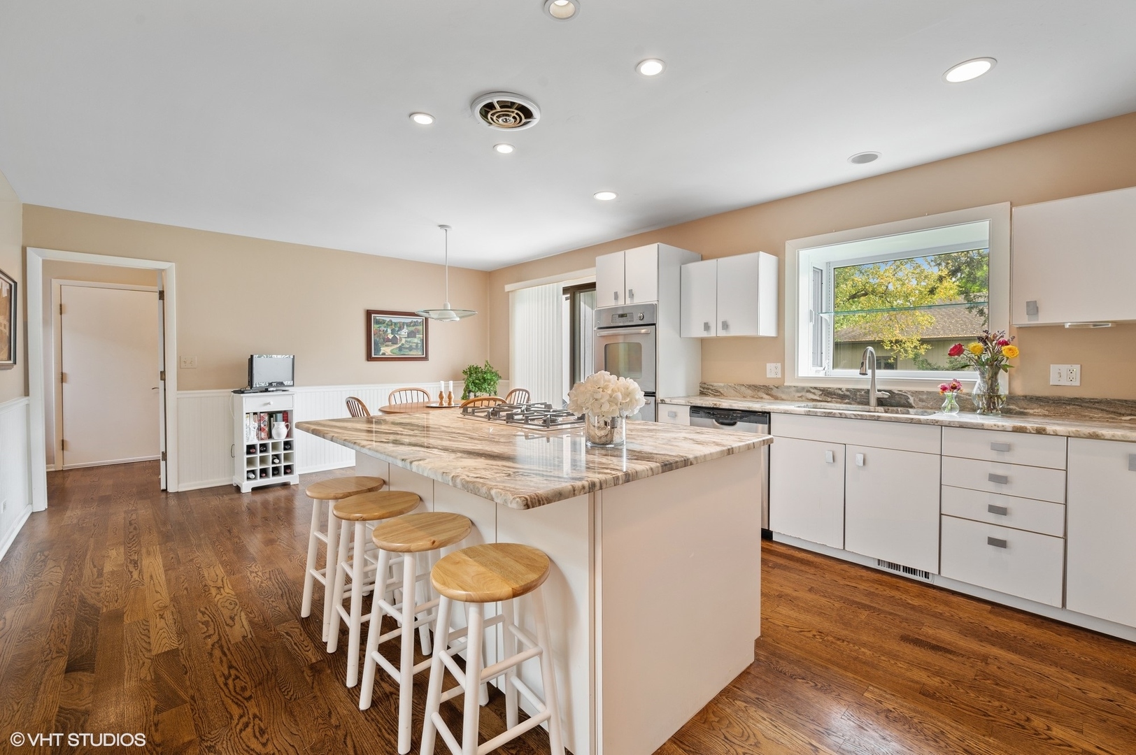 63 Overlook Drive Golf, IL 60029 - Photo 13 of 32 a large kitchen with kitchen island a sink table and chairs