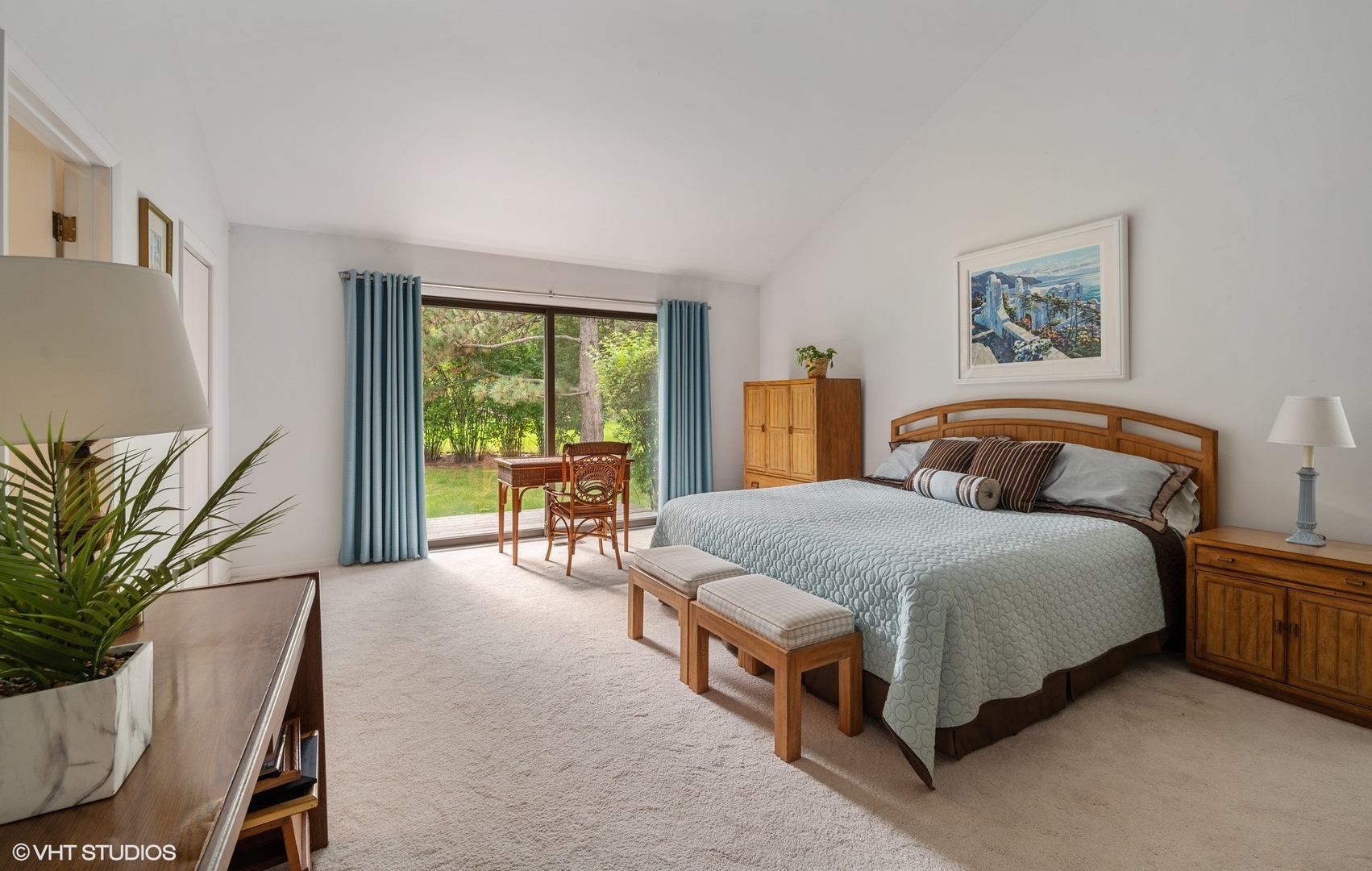 63 Overlook Drive Golf, IL 60029 - Photo 16 of 32 a spacious bedroom with a bed table chair and a window