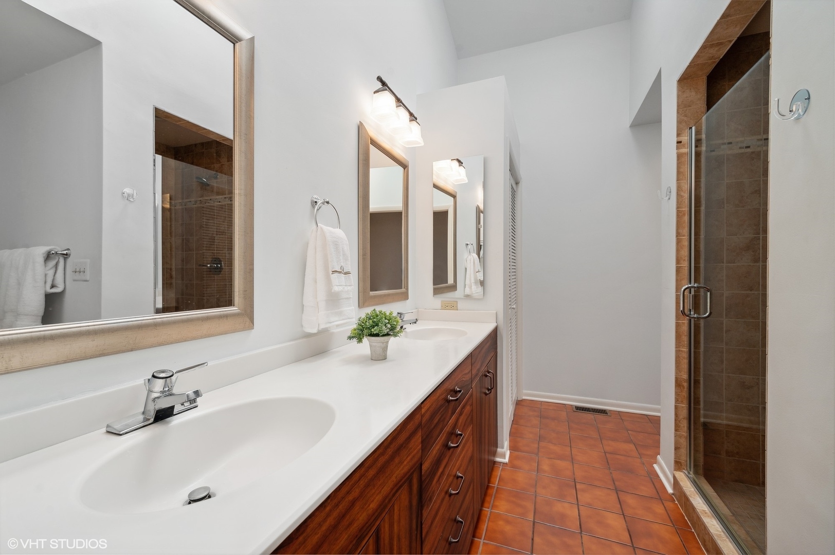 63 Overlook Drive Golf, IL 60029 - Photo 18 of 32 a bathroom with a sink and a mirror