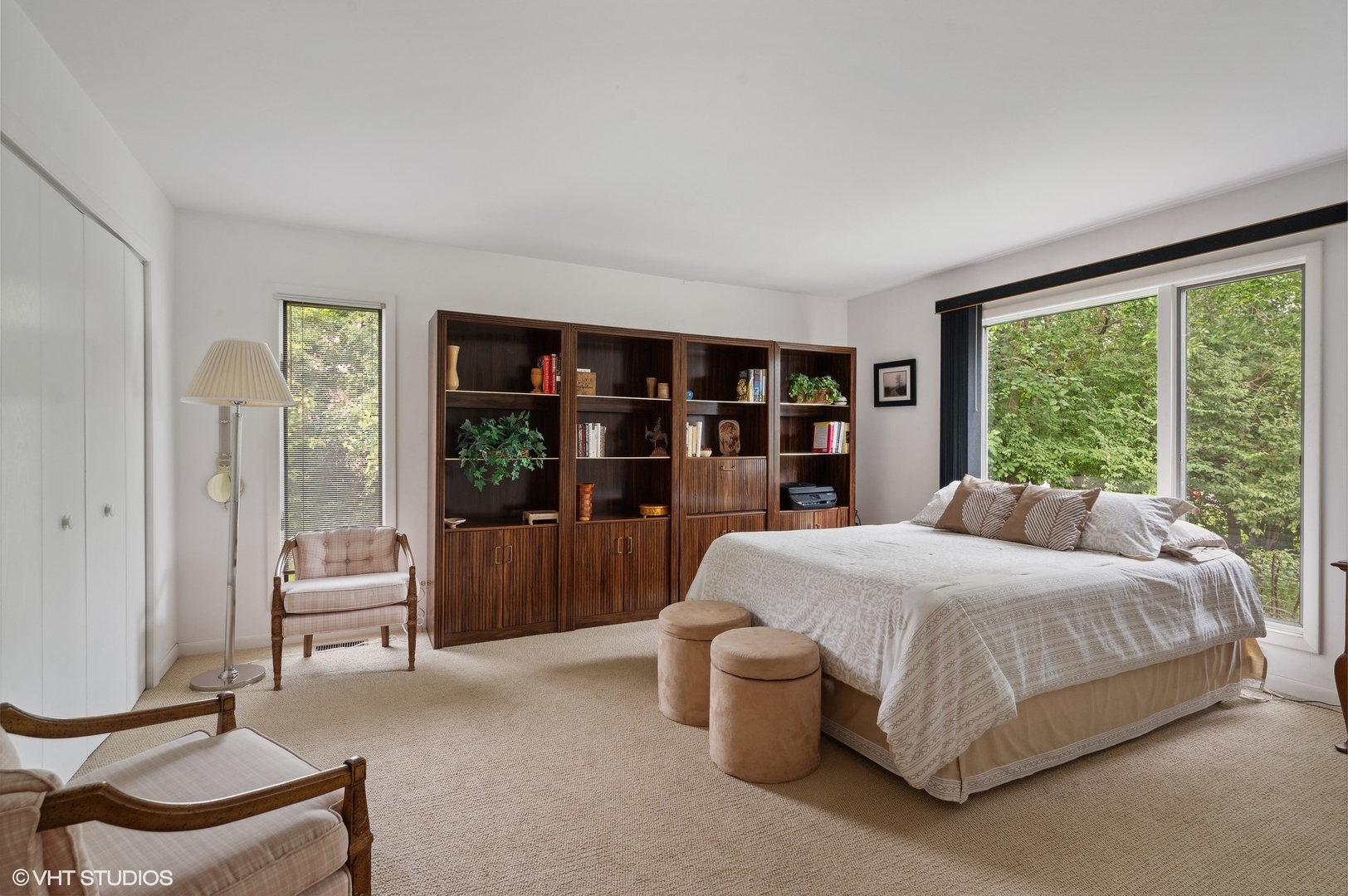 63 Overlook Drive Golf, IL 60029 - Photo 19 of 32 a bedroom with a bed and large window