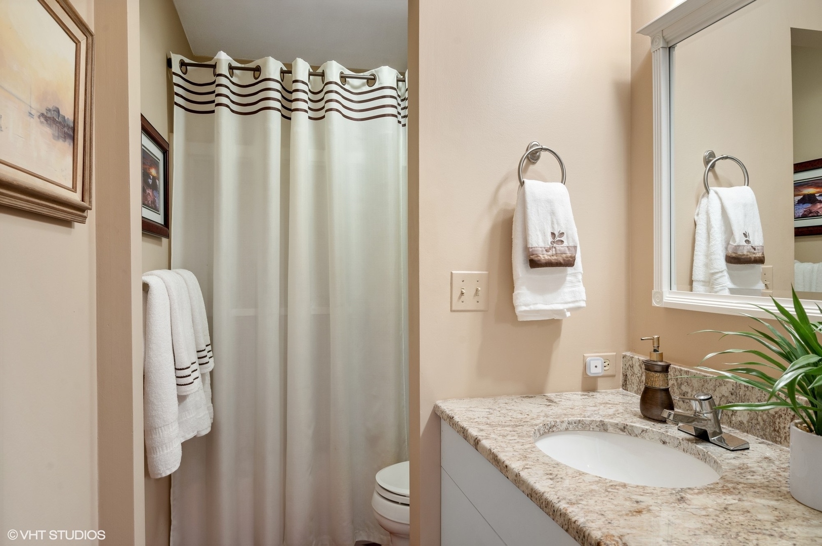 63 Overlook Drive Golf, IL 60029 - Photo 21 of 32 a bathroom with a granite countertop sink and a mirror