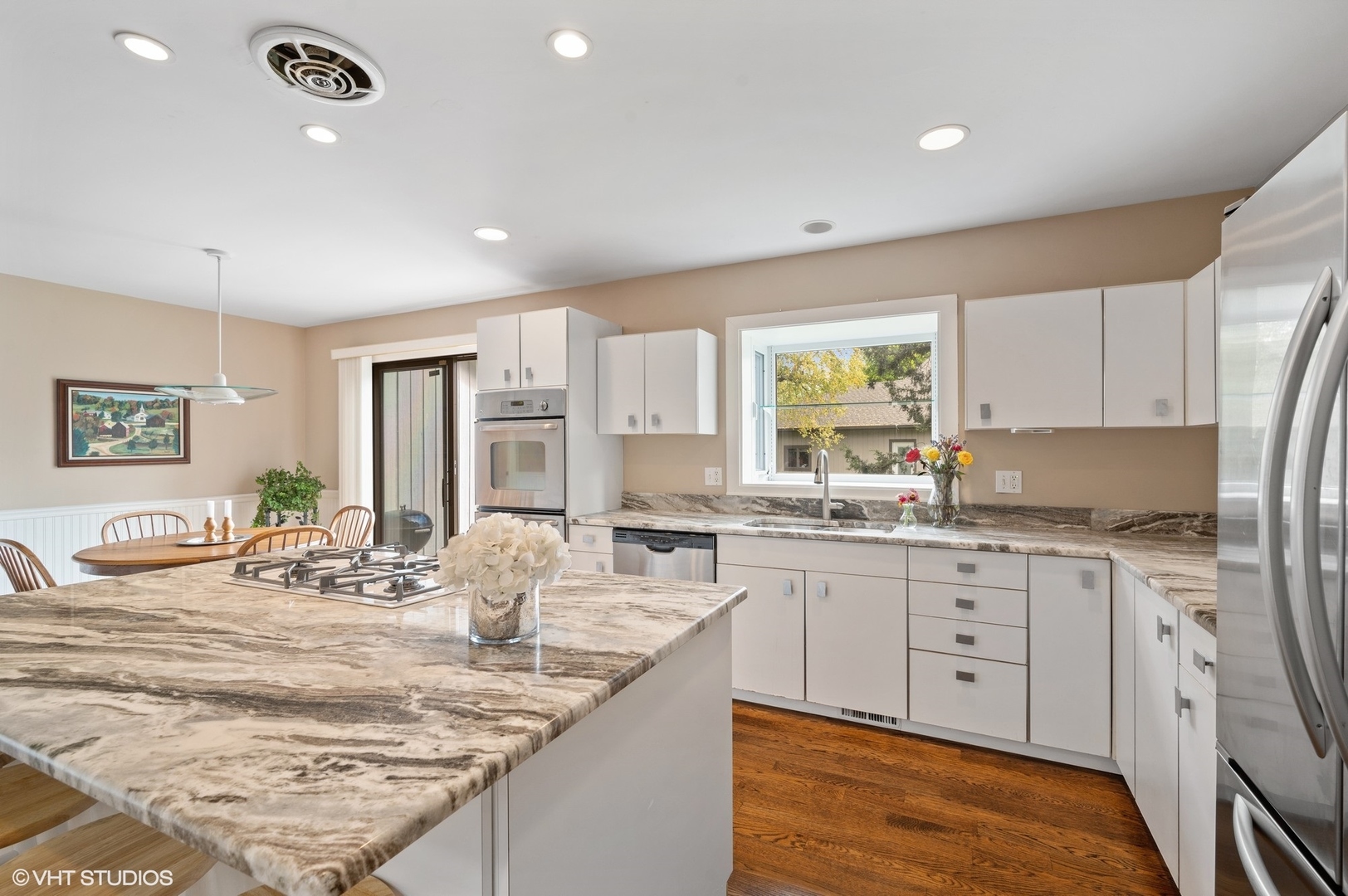 63 Overlook Drive Golf, IL 60029 - Photo 10 of 32 a kitchen with granite countertop sink and cabinets