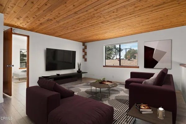 a spacious bedroom with a bed and a couch