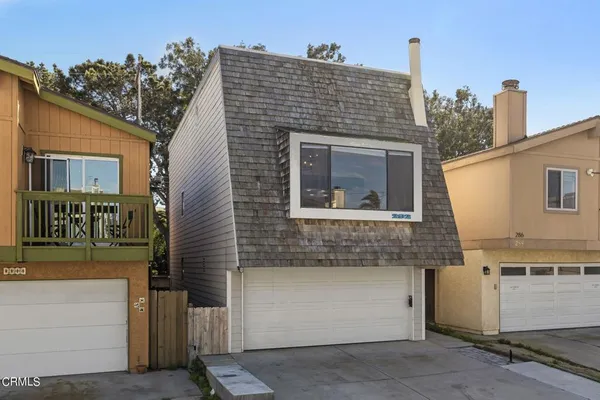 a front view of a house with a garage