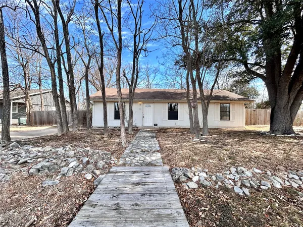 a backyard of a house with large trees