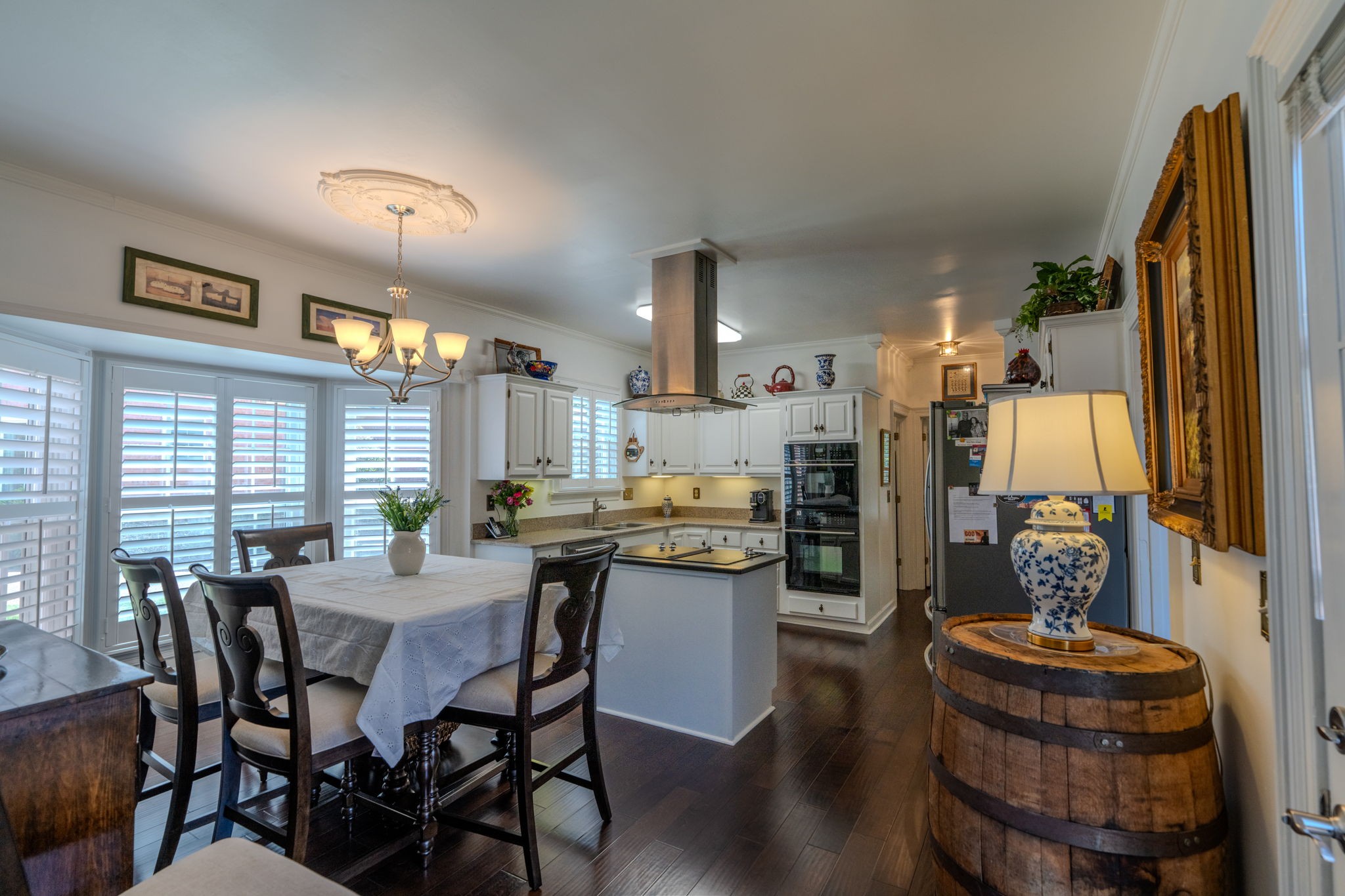 404 Chesterfield Place Franklin, TN 37064 - Photo 12 of 38 a dining room with stainless steel appliances kitchen island granite countertop a dining table chairs and a refrigerator