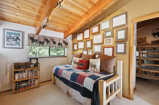 a bed room with a bed and a window