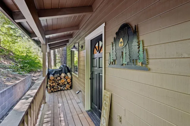 a view of a balcony with furniture and wooden floor