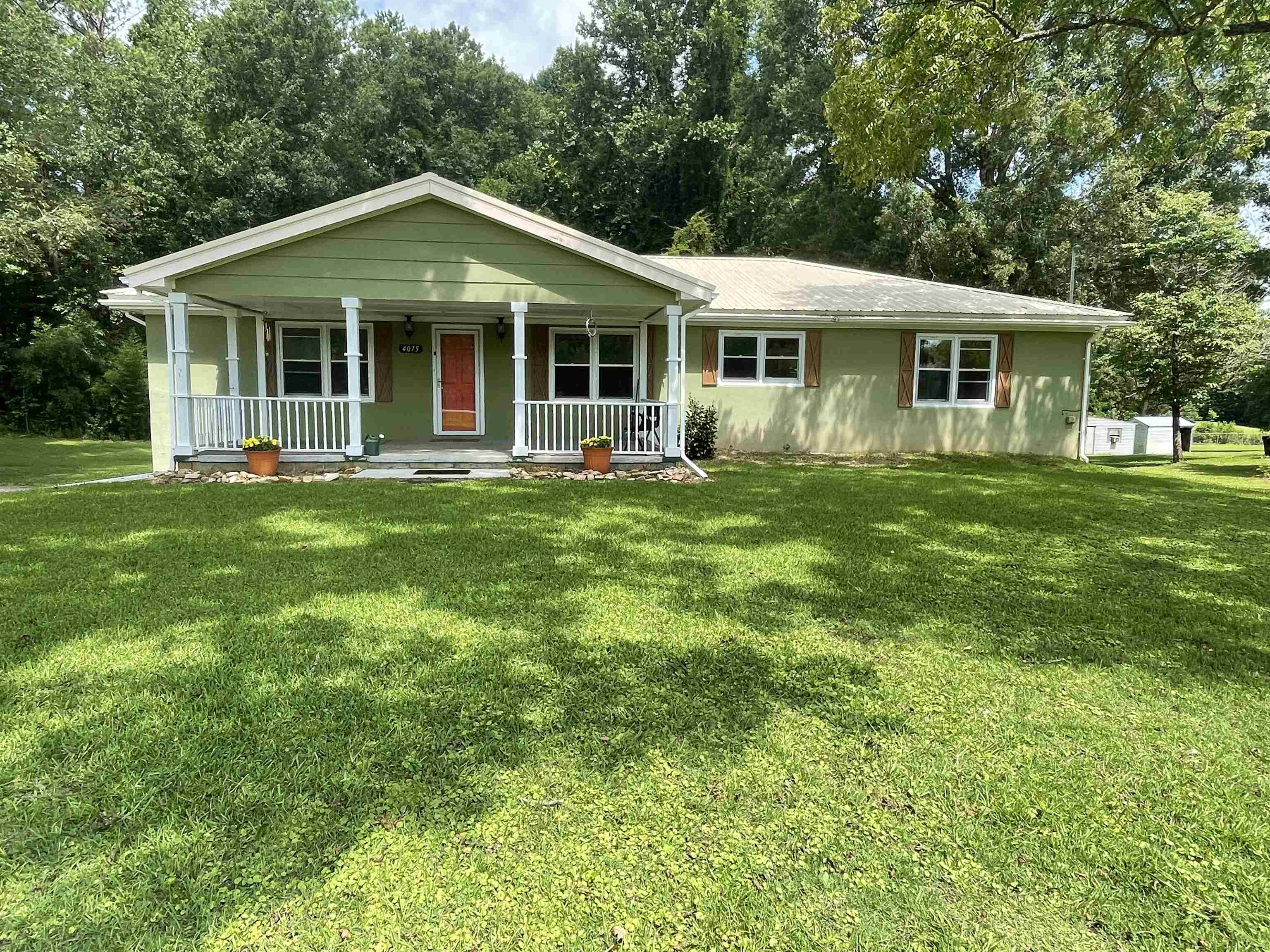 4075 Highway 29 Valley, AL 36854 - Photo 1 of 1 a front view of a house with a garden