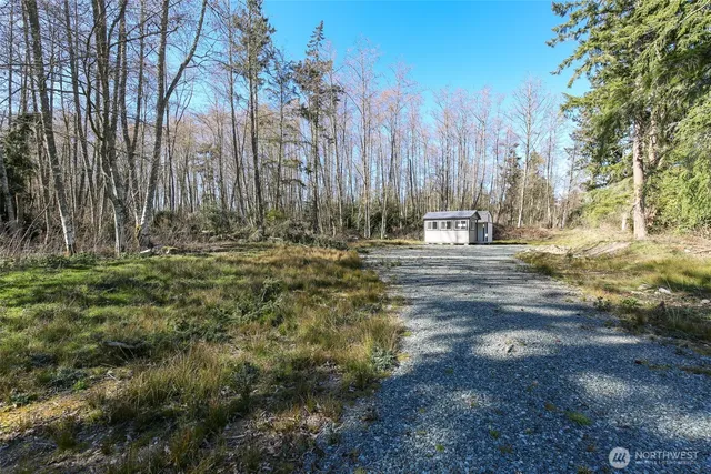 a wooden fence with trees in the background