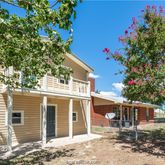 front view of a house with a tree