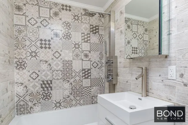 a bathroom with a sink and a bathtub