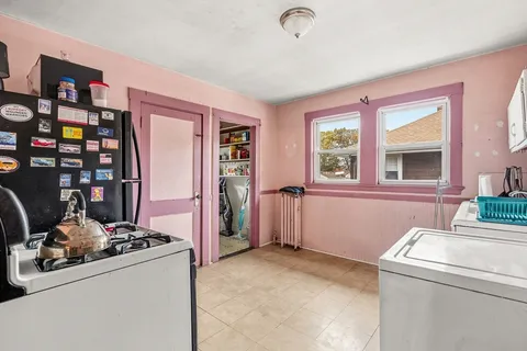 a view of livingroom with furniture and washer dryer