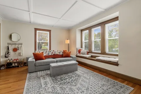 a living room with furniture and a rug