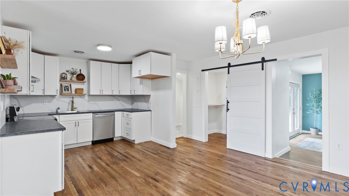 11550 Lunenburg County Road Keysville, VA 23947 - Photo 2 of 48 White cabinetry, dark countertops, wood-finish flo