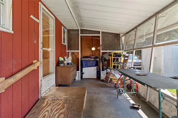 a view of an entryway with wooden stairs