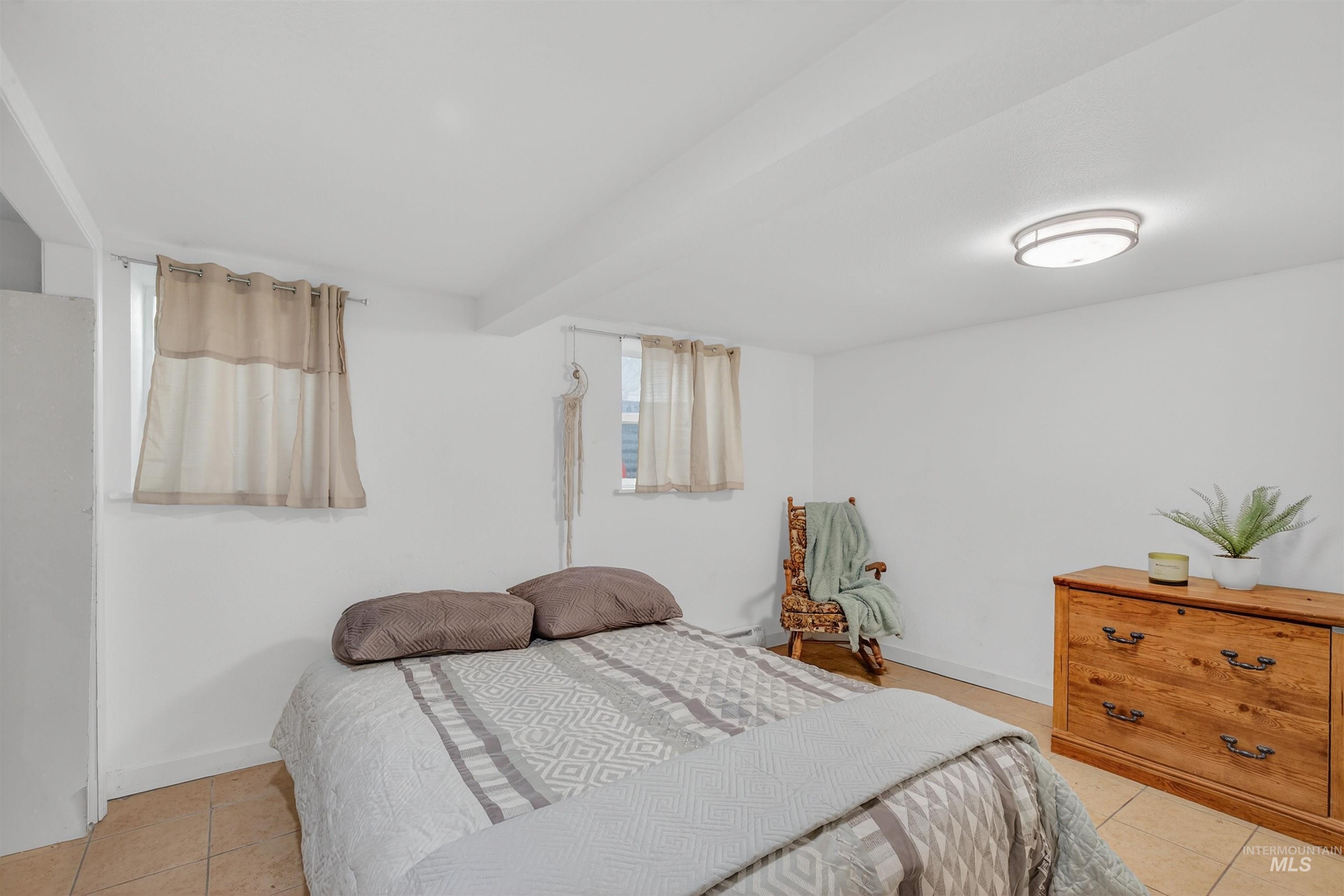 601 12th Street Clarkston, WA 99403 - Photo 9 of 21 Bedroom featuring light tile patterned flooring and baseboards