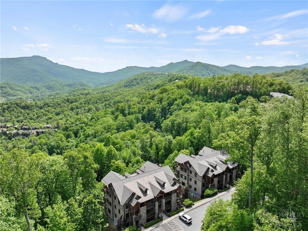 142 Evening View Lane, Unit CA3 Boone, NC 28607 - Photo 25 of 41 a view of a lush green field with mountains in the background
