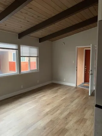 a view of an empty room with a window