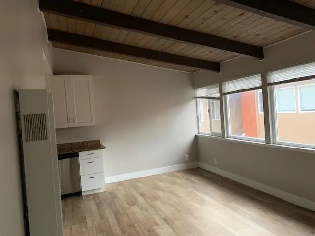 a view of a kitchen with electric appliances