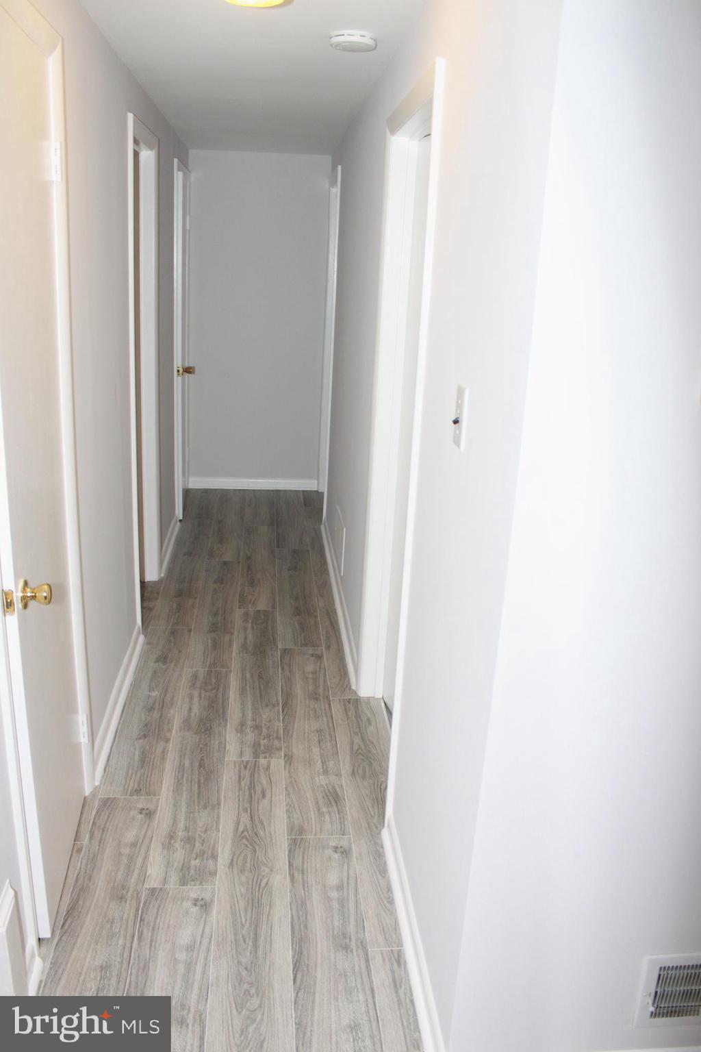 5507 Ashfield Road Alexandria, VA 22315 - Photo 20 of 41 upstairs hallway leading to cedar closet