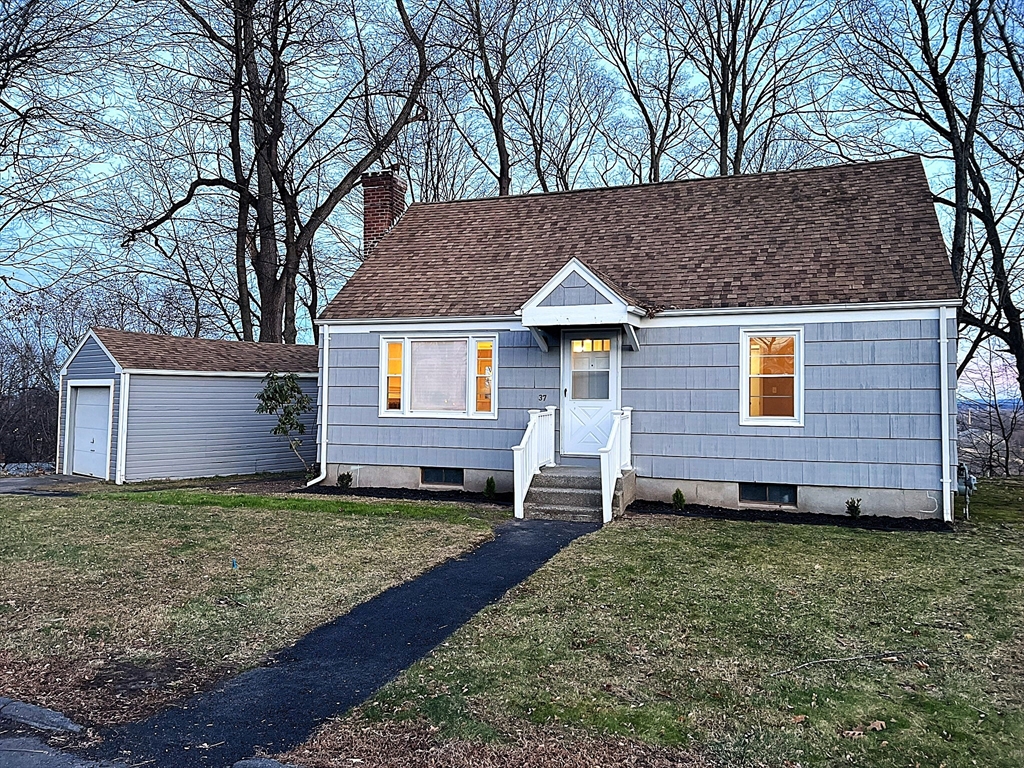 a front view of a house with a yard