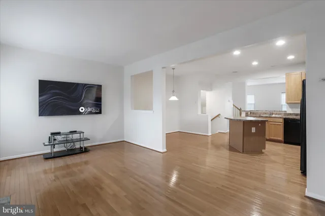 a view of kitchen with furniture and wooden floor