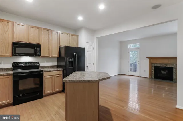 a view of a house with swimming pool and sitting area