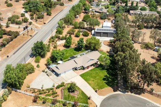 a living room with furniture and large windows